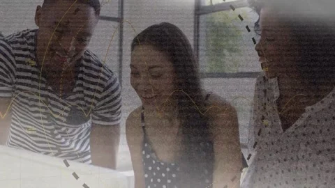 Team leaning over screen, center tapping pad, causing dashed circles and waves, Stock Footage 333734434