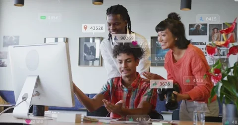 Team leaning over screen, using mouse and causing animated likes follows Stock Footage 331736143