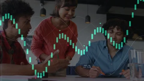 Team leaning over table, left man gesturing and initiating candlestick graphs Stock Footage 334788124