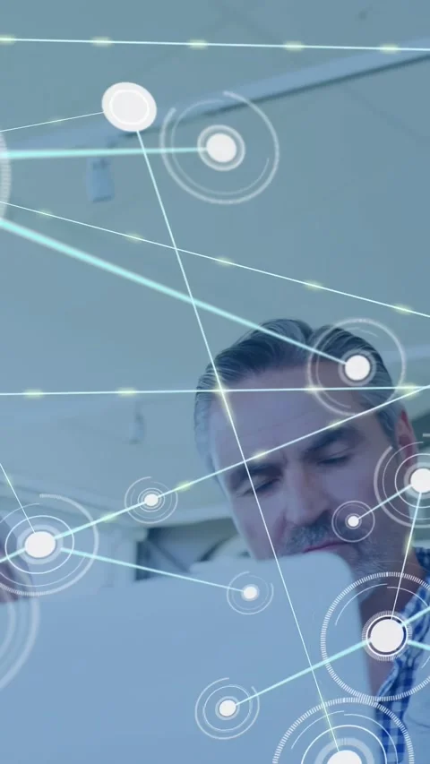 Team leaning over white screen, single glowing node appearing and mapping tech Stock Footage 331215387