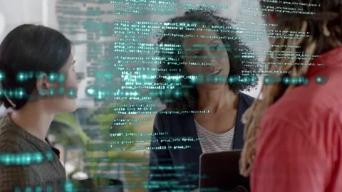 Team leaning round tablet right bringing tablet, lead explaining faint code and Stock Footage 333925140