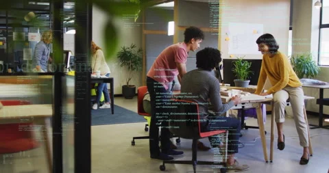 Team logging into PCs launching code overlay for software, collaborating while Stock Footage 315542060