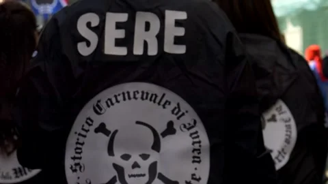 Team logo on the jacket back at the historic carnival of ivrea. Slow motion 4K Video stock 304087315