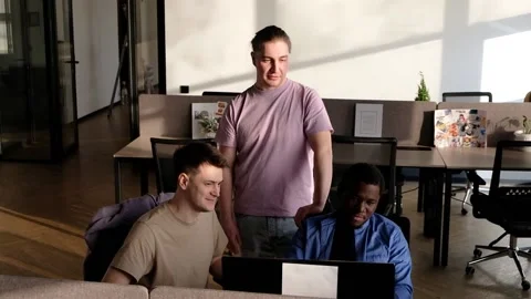 Team is looking for bug fixes. Programmers working in the office of a software Video stock 236054699