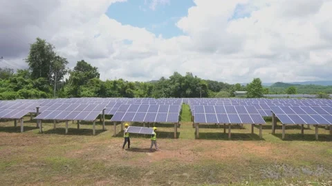 A team of male workers is about to install solar panels. Stock Footage 210817703
