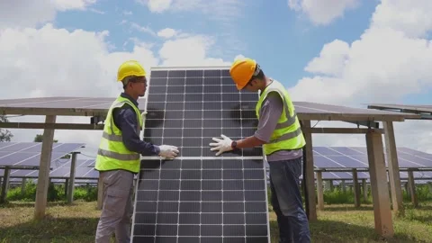A team of male workers is about to install solar panels. Stock Footage 210817868