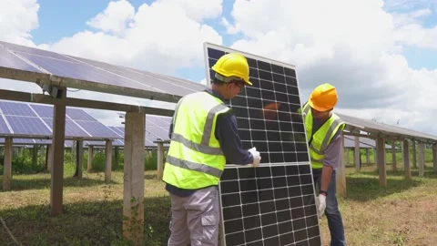 A team of male workers is about to install solar panels. Stock Footage 210817962
