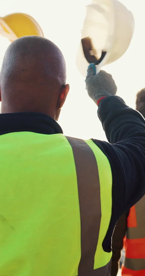 Team, man or construction worker wave helmet with celebration for finish Stock Footage 336847623