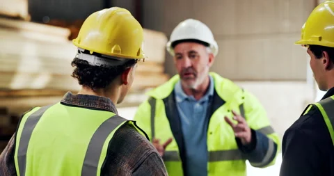 Team, manager and explain safety with helmet, protocol discussion or gear for Stock Footage 340000820