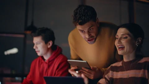 Team manager checking coworkers project looking laptops in night office closeup. Stock Footage 340112964