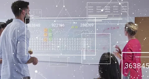 Team manager stepping forward annotating board in business meeting as data Stock Footage 318046295
