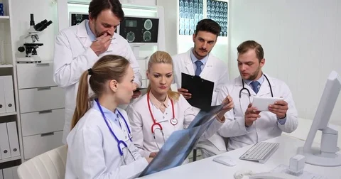 Team of Medical Doctors Checking Pulmonary X-Ray Advice Talking About Pneumonia Stock Footage 83425516