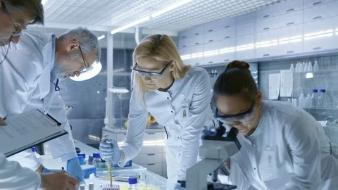 Team of Medical Research Scientists Work on a New Generation Disease Cure. Stock Footage