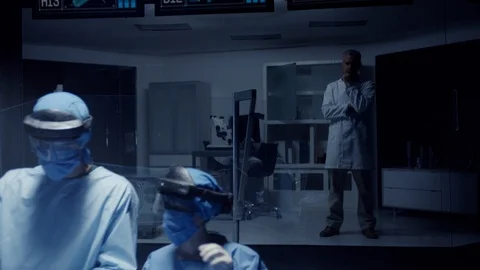 Team of Medical Surgeons use Augmented Holographic Technology. 스톡 동영상 122178451