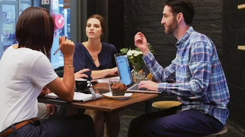 Team meeting brainstorm in cafe Stock Footage 58128162