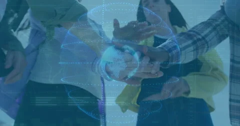 Team members placing hands in tech collaboration, showing holographic data globe Stock Footage 309287926