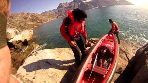 Team Members Prepare to Load Canoe into Greenland Sea Stock Footage 233603997