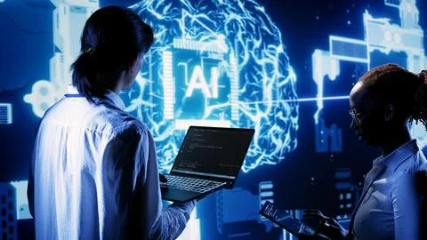 Team members run AI code in data center 스톡 사진