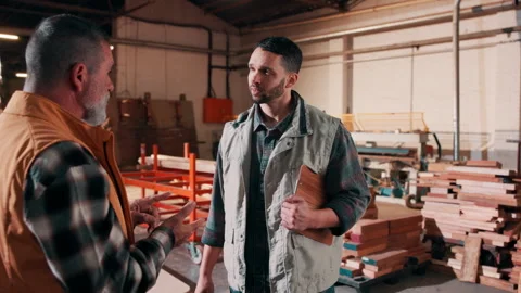 Team, men and talking in carpentry warehouse for production progress, project Stock Footage 337985695