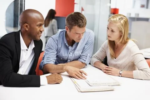 Team, mentor or advice with paperwork in office for policy premium, explain cove Stockfoto's