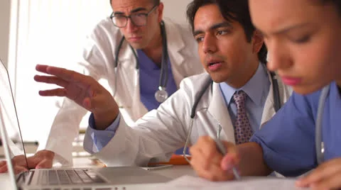 Team of Mexican doctors working on a laptop Video stock 25628768