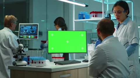 Team of microbiologists researching using computer with green screen Stock Footage 144882562
