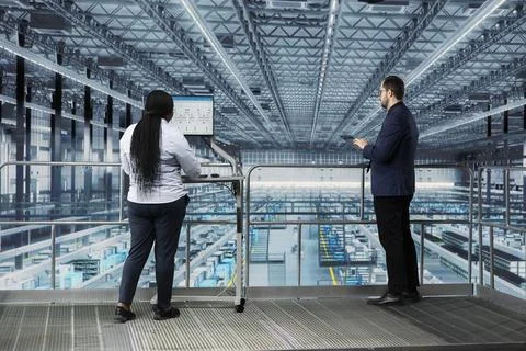 Team of microchip smart factory executives using MES software Stock Photos