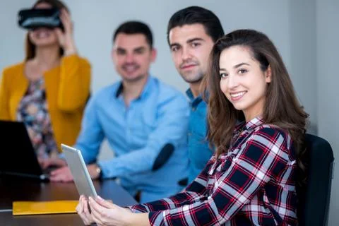 Team of motivated people using various devices at a startup metting Stock Photos