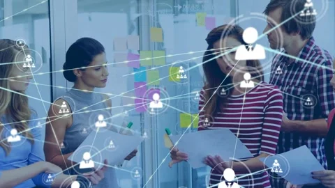Team moving sticky notes and tapping tablet, creating animated icon network over Stock Footage 333802972