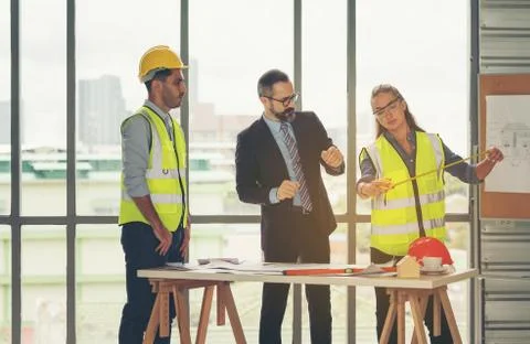 Team of multiethnic architects working on construction plans in meeting room. Foto stock