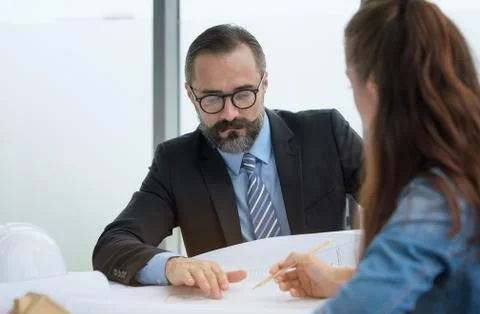 Team of multiethnic architects working on construction plans in meeting room. Foto stock
