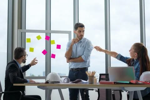 Team of multiethnic architects working on construction plans in meeting room. Foto stock