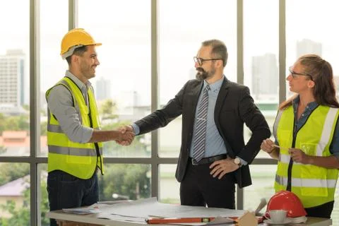 Team of multiethnic architects working on construction plans in meeting room. Foto stock