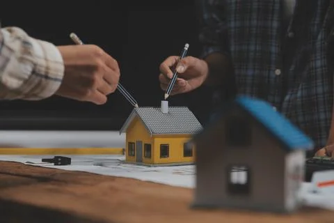 Team of multiethnic architects working on construction plans in meeting roo.. Foto stock