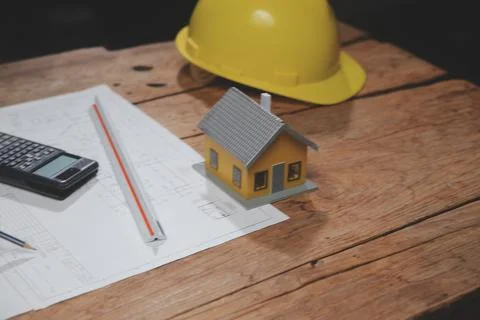 Team of multiethnic architects working on construction plans in meeting roo.. Stock Photos