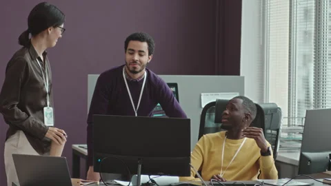 Team of Multiethnic Software Developers Talking at Workplace Stock Footage 247622351