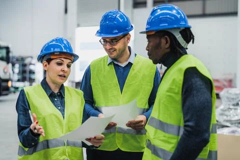 Team of multiracial engineers working in robotic factory - Tech industry concept 스톡 사진