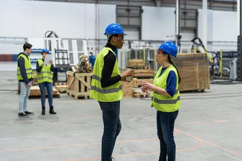 Team of multiracial engineers working in robotic factory - Tech industry concept 스톡 사진