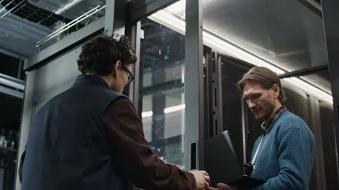 Team of Network Engineers Managing Hardware Inside Data Center Server Room Stock Footage 330543920