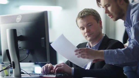 Team of Office Workers Have Discussion Next to Computer Stock Footage