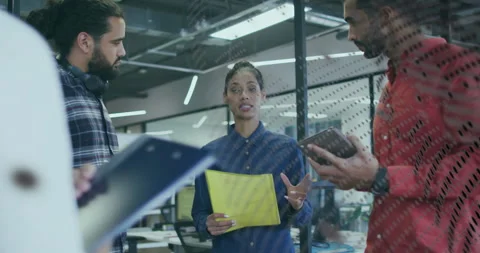 Team opening folder, scrolling tablet while dotted glass pattern drifting for Stock Footage 315562686