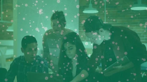 Team opening laptop, pointing at screen and jotting notes for project planning Video stock 329972367