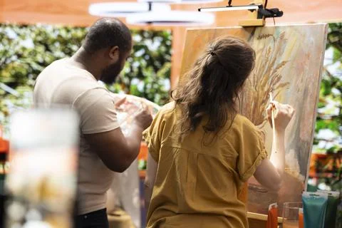 Team of painters recording an artistic tutorial for the internet art class 스톡 사진