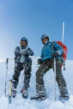 Team on the peak of mountain Stock-Fotos