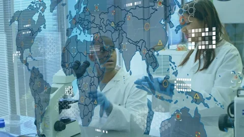 Team peering microscope and scrolling tablet in lab updating transparent data Stock Footage 320066935