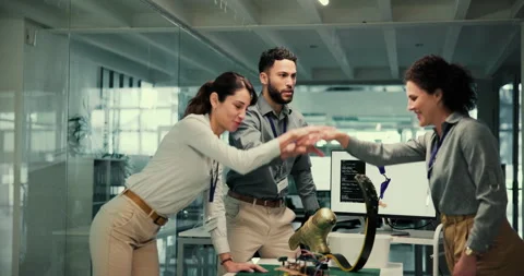 Team, people and stack hands in lab for prosthetic leg, blade and goals with Stock Footage 283594566