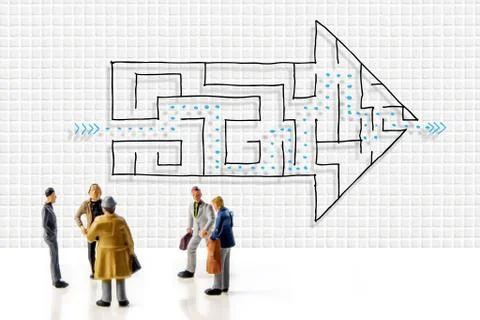 Team of people solving a difficult maze problem, finding best possible soluti Stock Photos