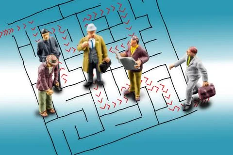 Team of people solving a difficult maze problem, finding best possible soluti Stock Photos