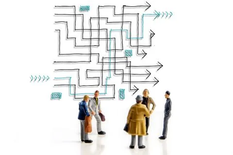Team of people solving a difficult maze problem, finding best possible soluti Stock Photos