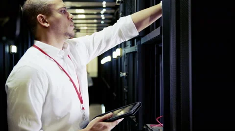 Team of people working in a data centre Stock Footage 67114965